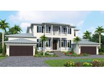 Stunning two-story home featuring a balcony, dark shutters, two-car garage, and lush landscaping at 118 N Warbler Ln, Sarasota, FL 34236