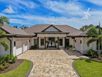 Stunning curb appeal! This home features a tile roof,modern facade, and a spacious driveway at 11826 River Shores Trl, Parrish, FL 34219