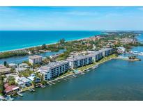 Aerial view of waterfront condo building at 9011 Midnight Pass Rd # 228, Sarasota, FL 34242