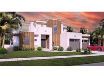Modern house exterior with two-car garage and landscaping at 640 N Owl Dr, Sarasota, FL 34236