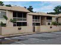 Attractive exterior of a condo building with parking at 3360 S Osprey Ave # 102B, Sarasota, FL 34239