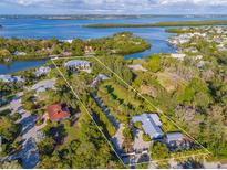 Aerial view of two waterfront properties at 6680 Gulf Of Mexico Dr, Longboat Key, FL 34228