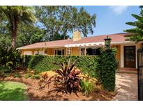 Attractive home with lush landscaping and a stone walkway at 1713 North Dr, Sarasota, FL 34239