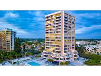 Aerial view of high rise building and pool at 5400 Ocean Blvd # 6-4, Sarasota, FL 34242
