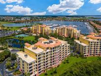 Aerial view of luxury waterfront community with marina and resort amenities at 611 Riviera Dunes Way # 308, Palmetto, FL 34221
