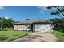 Newly built home with gray siding, two-car garage, and manicured lawn at 2148 Agra St, Port Charlotte, FL 33980