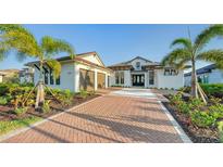 Stunning home exterior with brick driveway at 1095 Blue Shell Loop, Sarasota, FL 34240