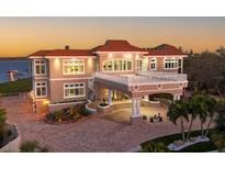 Luxury waterfront home with circular driveway and stunning sunset views at 7159 Manasota Key Rd, Englewood, FL 34223