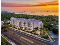 Aerial view of a modern building near the water at 4959 N Remington Dr # 111, Sarasota, FL 34234