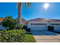 Attached garage and well-maintained landscaping at 1779 San Silvestro Dr, Venice, FL 34285