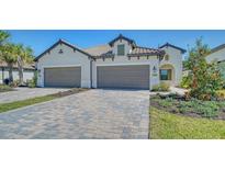 Two-car garage home with Mediterranean style at 27460 Janzen Ct, Englewood, FL 34223