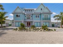 Charming two-story waterfront home with a unique design and landscaping at 118 Mangrove Ave, Anna Maria, FL 34216