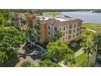 Aerial view of condo building near lake and golf course at 6360 Watercrest Way # 301, Bradenton, FL 34202