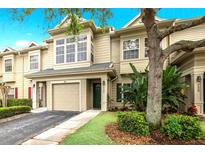 Two-story townhome with attached garage and manicured landscaping at 7632 Plantation Cir, Bradenton, FL 34201