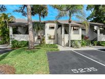 Two-story condo building with parking and landscaping at 5235 Willow Links # 41, Sarasota, FL 34235