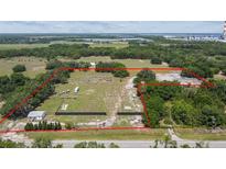 Aerial view of property with home and large lot at 18050 State Road 62, Parrish, FL 34219