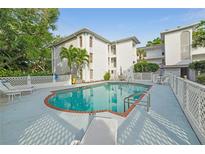 A refreshing pool area in a well-maintained community offers a relaxing oasis for residents and guests at 6304 Pointe West Blvd # A102, Bradenton, FL 34209