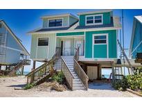 Beachfront duplex with two units, elevated position, and stairs at 301 S Gulf Blvd # 20, Placida, FL 33946