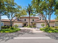 Beautiful two-story home with a brick driveway and lush landscaping at 1703 Starling Dr # 1703, Sarasota, FL 34231