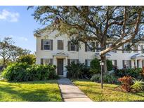 Two-story townhome with shutters, walkway, and landscaping at 5654 Simonton St, Bradenton, FL 34203