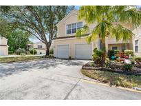 Front view of two-story house with double garage and palm tree at 6412 Rosefinch Ct # 101, Lakewood Ranch, FL 34202