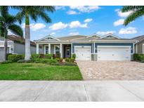 Two-story home with a two-car garage at 5565 Long Shore Loop, Sarasota, FL 34238