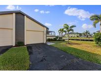 Two-car garage and waterfront view at 3920 Bal Harbor Blvd # D8, Punta Gorda, FL 33950