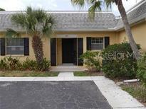 Condo entrance with well manicured landscaping at 2411 Aspinwall St # 2411, Sarasota, FL 34237