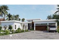 Modern home with a two-car garage and sleek design at 1429 N Lake Shore Dr, Sarasota, FL 34231