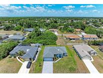 Aerial view of a house in a residential neighborhood at 8380 Malcolm Ave, North Port, FL 34287
