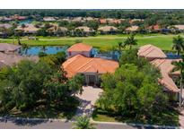 Luxury home with tile roof and large lot, located on a golf course at 10402 Riverbank Ter, Bradenton, FL 34212