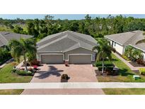 Aerial view of a two-car garage home at 13458 Abercrombie Dr, Englewood, FL 34223