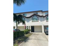 Two-story townhouse with attached garage at 324 Madeira Cir, Tierra Verde, FL 33715