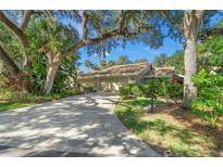 Lovely house exterior with a long driveway at 4560 Forest Wood Trl # 16, Sarasota, FL 34241