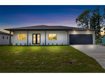 Modern two-bedroom house with a two-car garage at 4593 Targee Ave, North Port, FL 34287