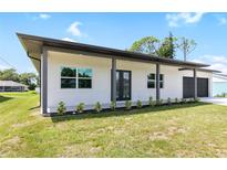 Modern two-bedroom house with a two-car garage at 4593 Targee Ave, North Port, FL 34287