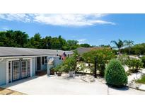 Single story home with double doors, nicely landscaped, and a long driveway at 3005 39Th W Ave, Bradenton, FL 34205