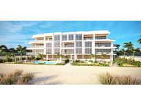 Beachfront building with pool and outdoor patio area at 70 Avenida Veneccia # 402, Sarasota, FL 34242