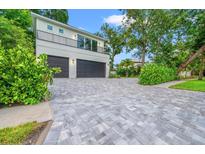 Two-car garage with paver driveway at 2171 Mcclellan Pkwy, Sarasota, FL 34239