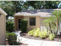 Exterior view of condo with landscaped walkway at 1213 Tallywood Dr # 7007, Sarasota, FL 34237