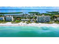 Stunning aerial view of the beachfront property and surrounding area at 4350 Chatham Dr # E307, Longboat Key, FL 34228