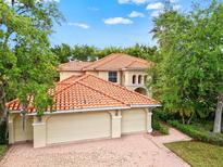 Beautiful two-story home with three-car garage and tile roof at 10115 Day Lily Ct, Bradenton, FL 34212
