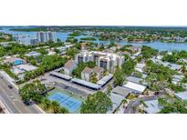 Condominium complex with tennis court and parking at 6157 Midnight Pass Rd # E24, Sarasota, FL 34242