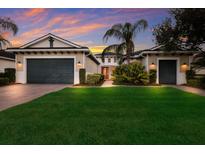 Two-car garage, well-manicured lawn, and appealing facade at 5209 Lake Overlook Ave, Bradenton, FL 34208