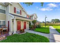 Tan townhouses with red doors and well-maintained landscaping at 4850 51St W St # 4204, Bradenton, FL 34210