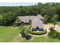Large home with a spacious backyard and lush landscaping at 4714 Elder Berry Dr, Sarasota, FL 34241