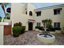 Building exterior featuring a courtyard with a fountain at 6101 34Th W St # 1E, Bradenton, FL 34210
