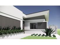 Contemporary home showcasing its sleek, clean lines and manicured landscaping at 2344 Bay W St, Sarasota, FL 34237