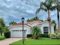 Single Gathering home with attached garage and landscaped yard at 5201 Highbury Cir, Sarasota, FL 34238