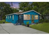 Charming blue house with a spacious driveway at 1604 3Rd W Ave, Palmetto, FL 34221